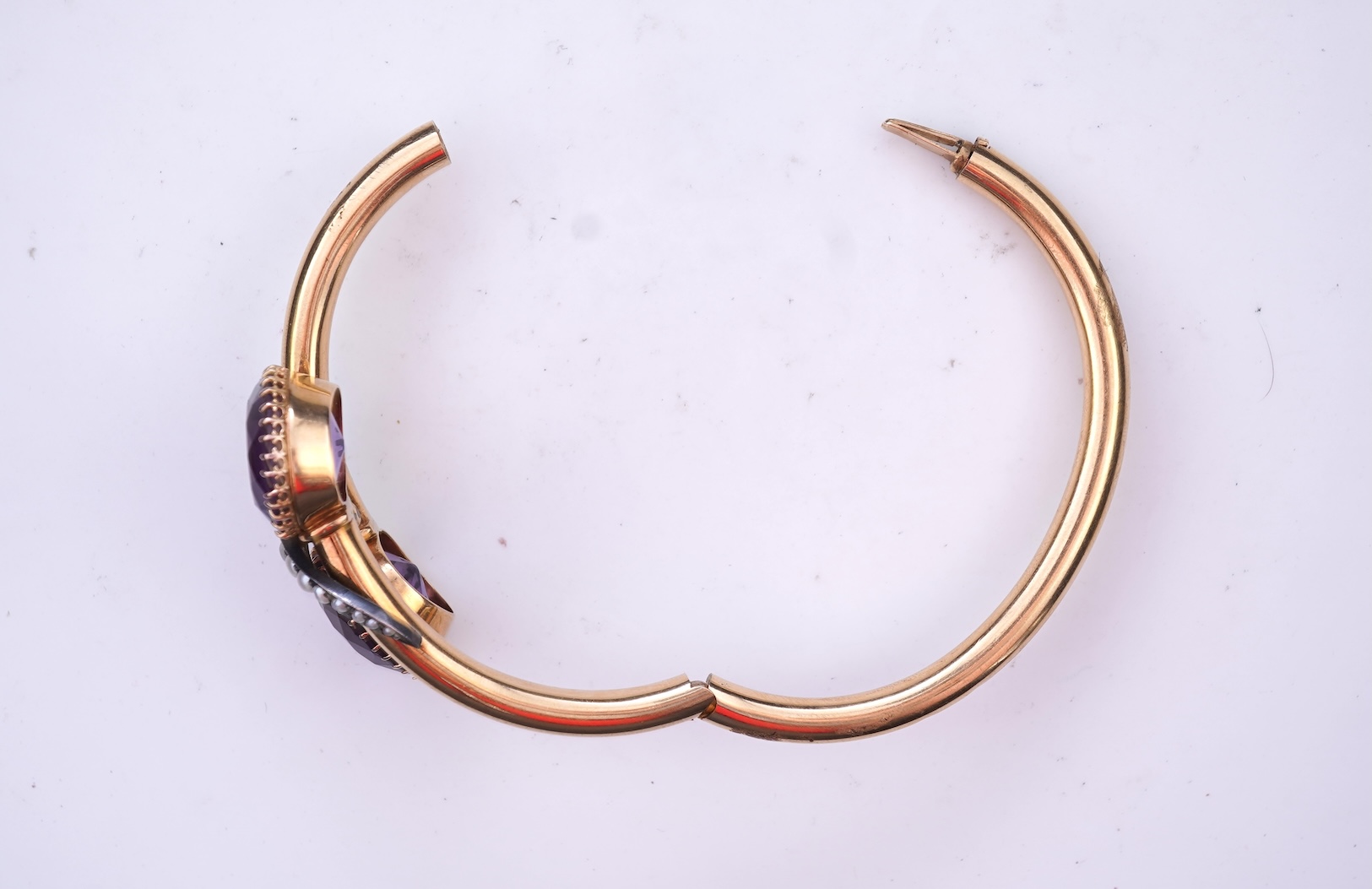 A Victorian gold, pearl and amethyst bangle, late 19th century